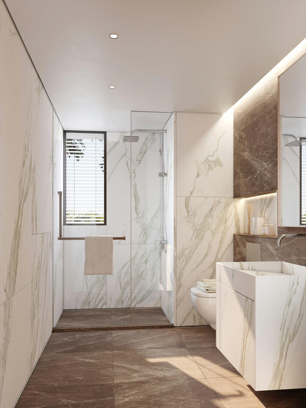 Remodeled Seattle primary bathroom with curbless walk-in shower, large-format tile, and custom double vanity