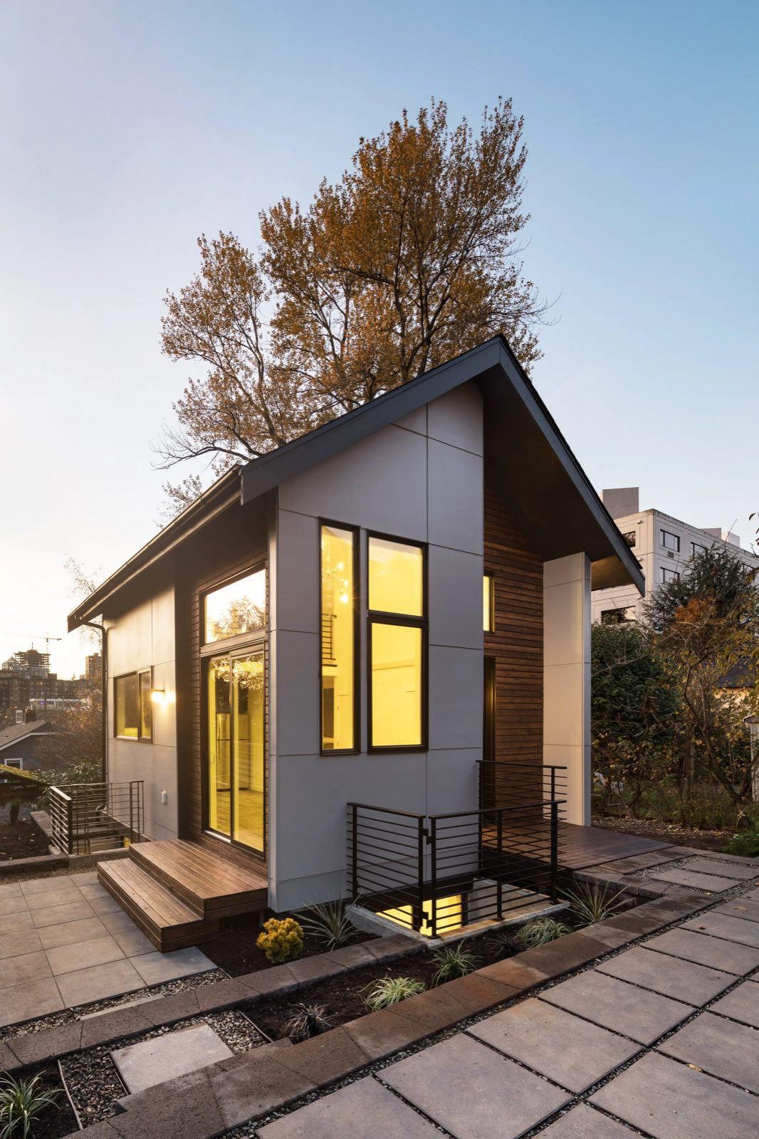 Detached backyard structure with cedar siding and large windows