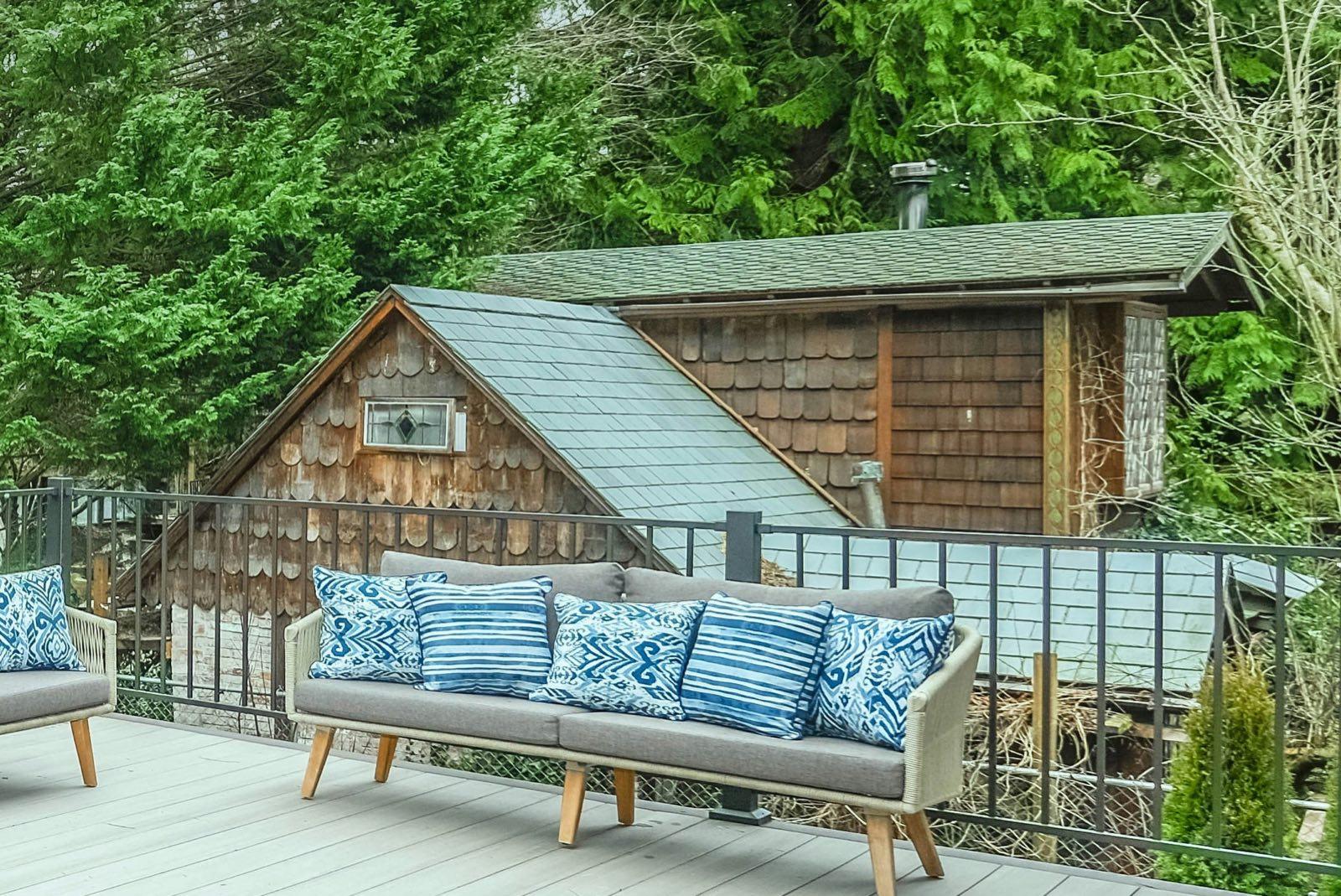 Backyard shed and deck in a Pacific Northwest yard