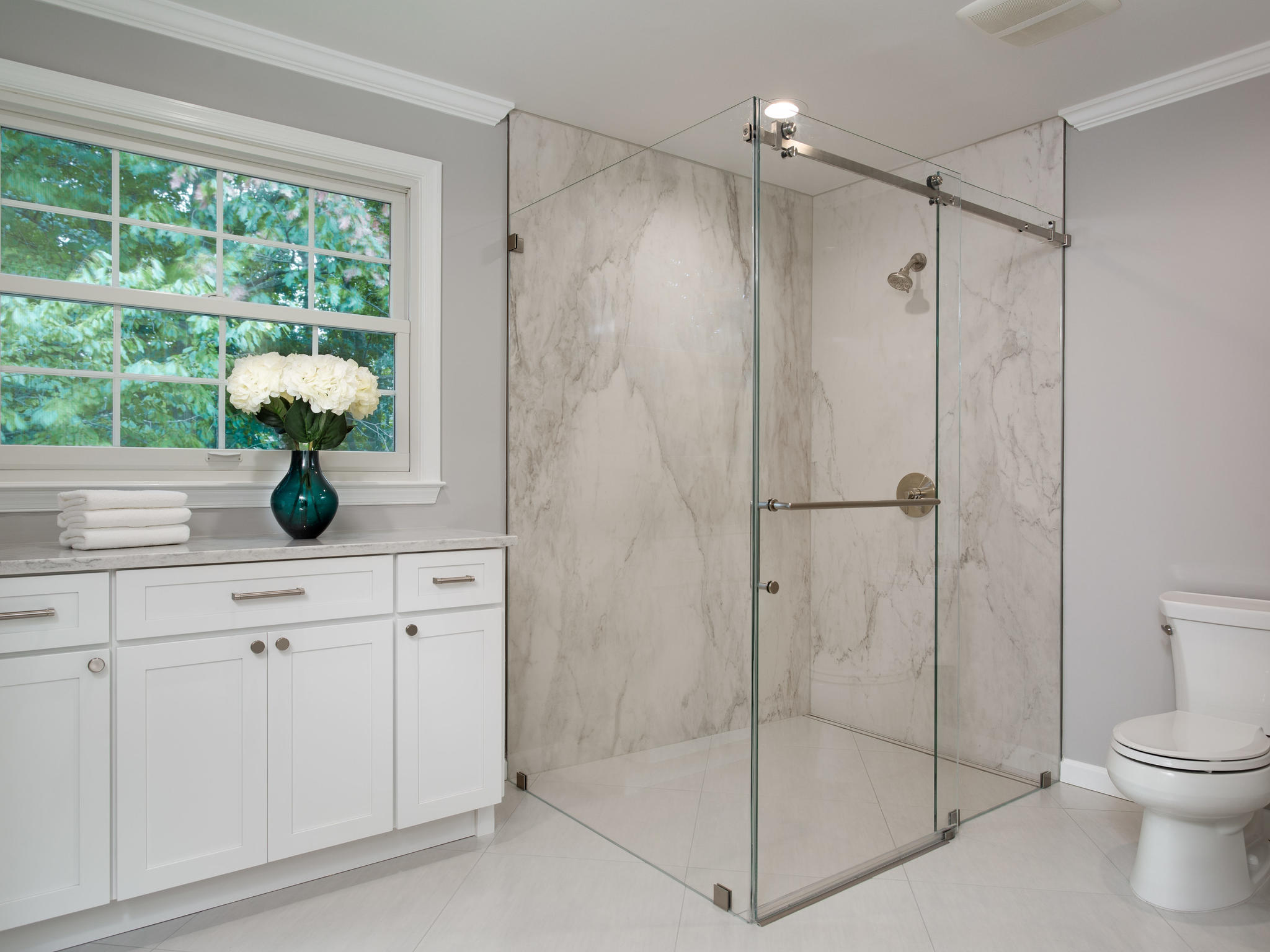 Close-up of handmade ceramic wall tile with contrasting grout and recessed niche in a Seattle bathroom remodel